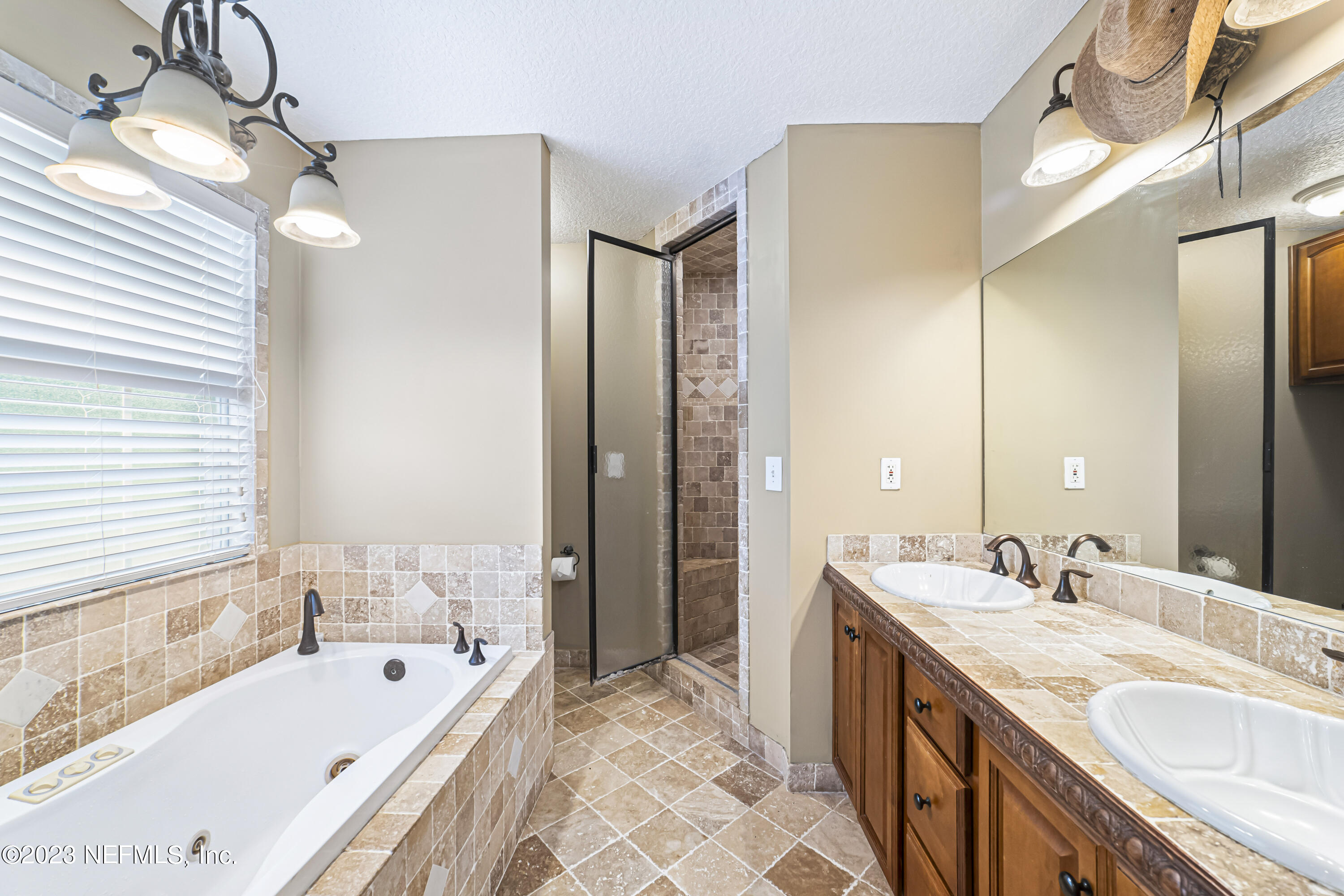 54412 Church Road Callahan, FL 32011 - Photo 17 of 47 a spacious bathroom with a tub sink and mirror