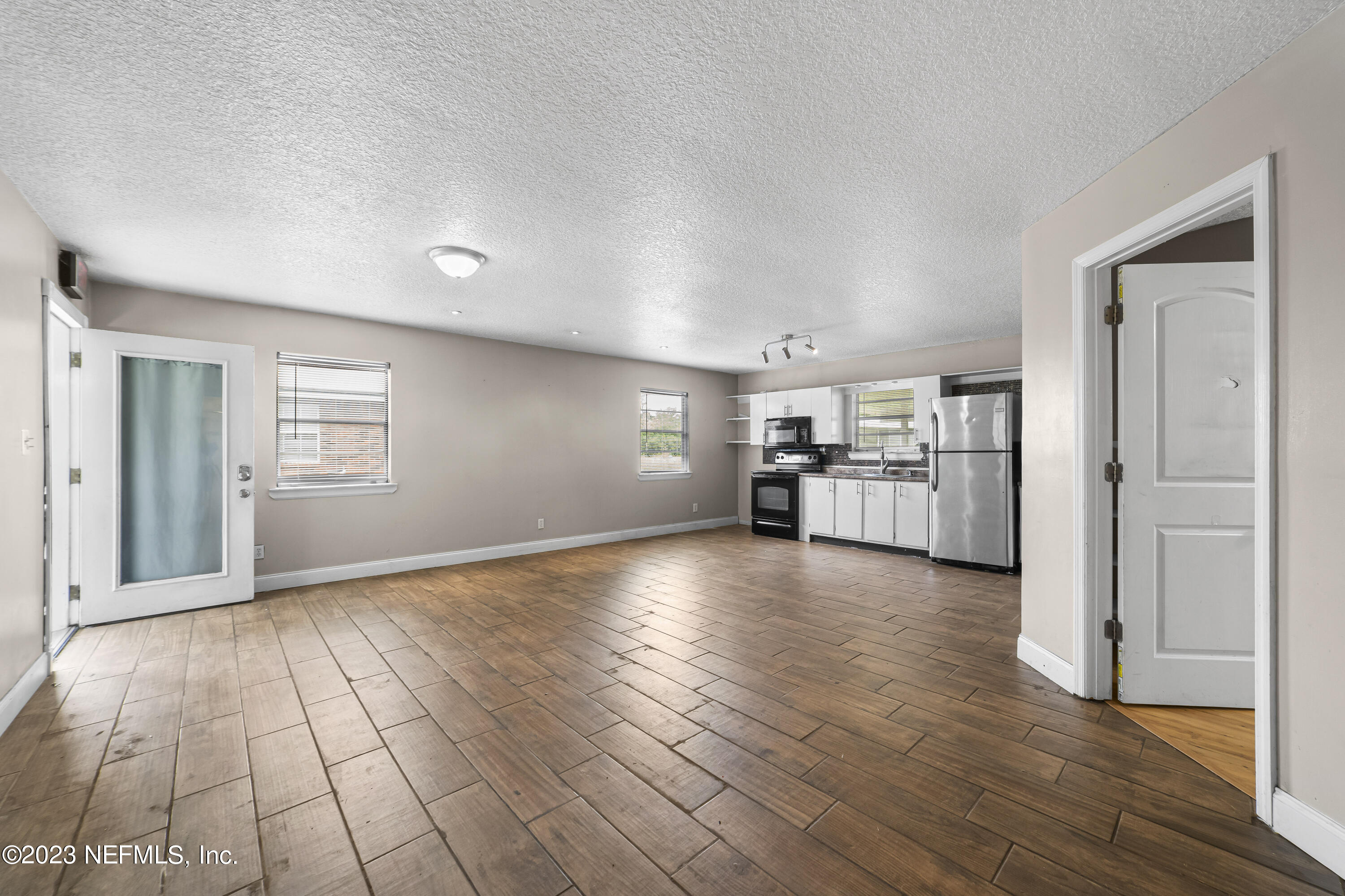 54412 Church Road Callahan, FL 32011 - Photo 37 of 47 a view of a kitchen with furniture and wooden floor