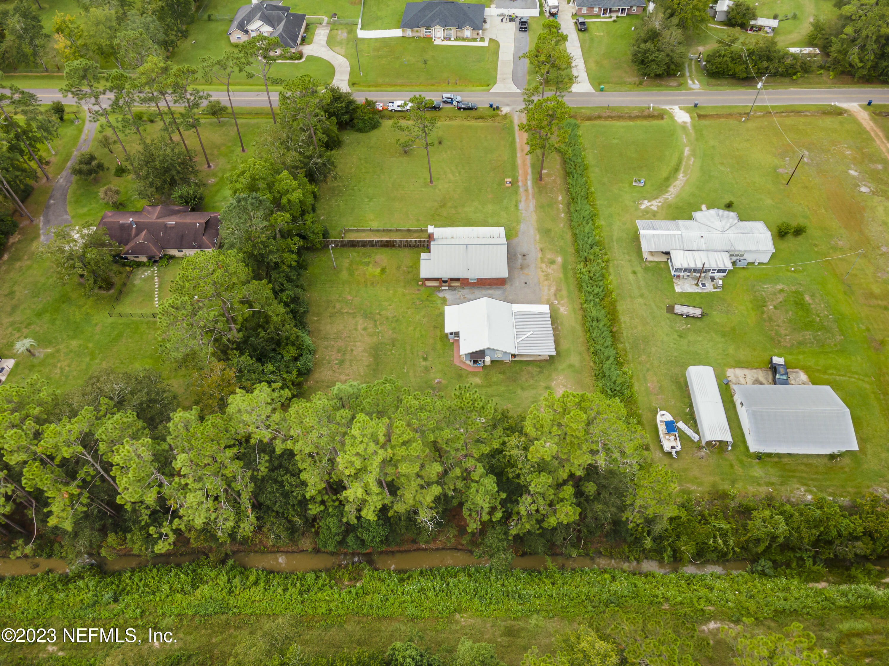 54412 Church Road Callahan, FL 32011 - Photo 44 of 47 an aerial view of residential house with outdoor space and swimming pool