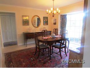 801 Golden Road Tryon, NC 28782 - Photo 2 of 24 a view of a dining room with furniture and chandelier