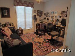 801 Golden Road Tryon, NC 28782 - Photo 15 of 24 a bedroom with furniture and a rug