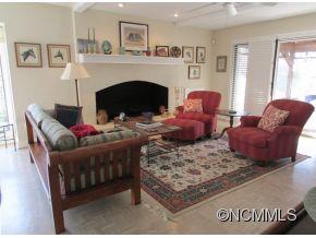801 Golden Road Tryon, NC 28782 - Photo 4 of 24 a living room with furniture and a fireplace