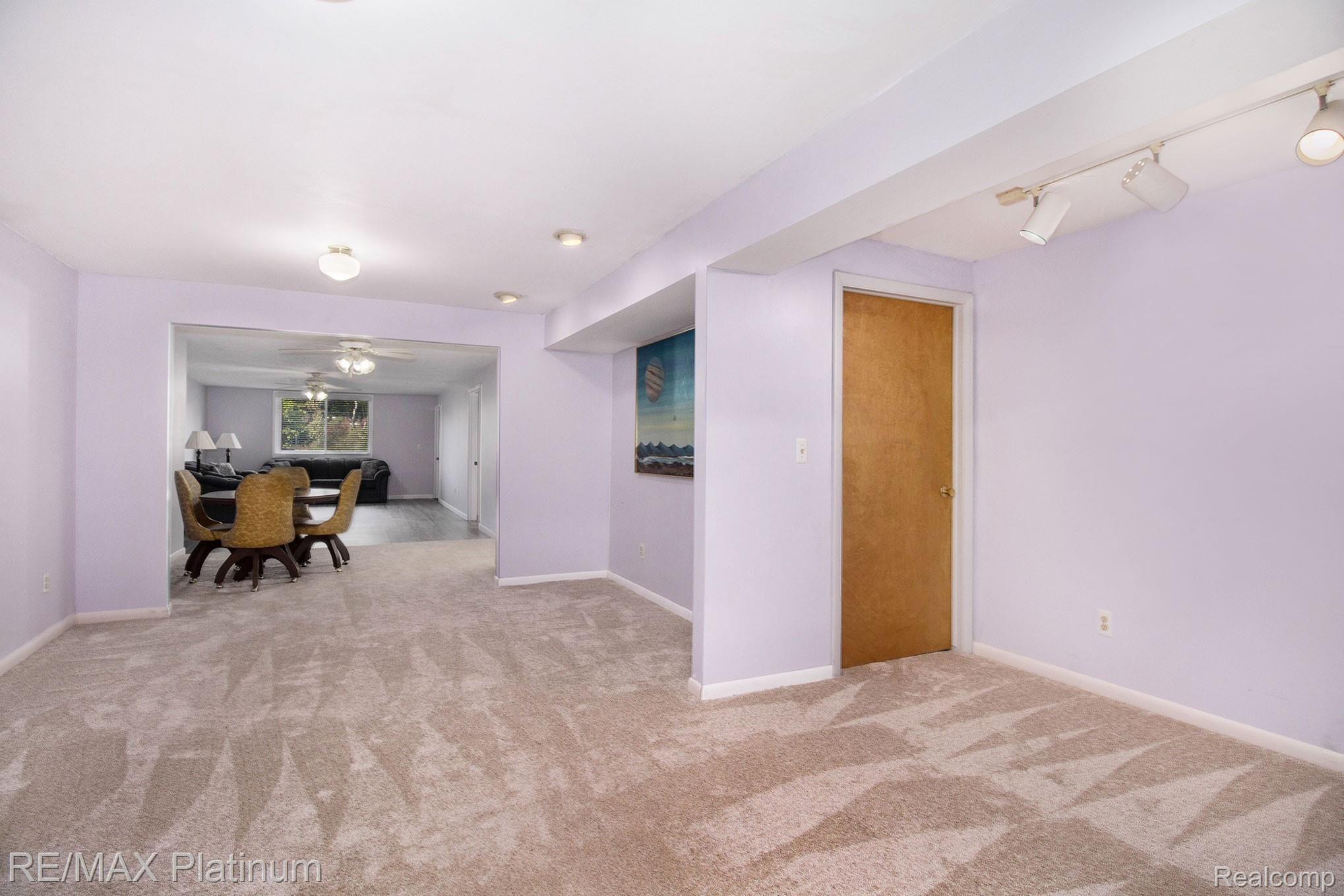7799 Golf Club Road Howell, MI 48843 - Photo 19 of 38 Finished Basement w/ Daylight Windows