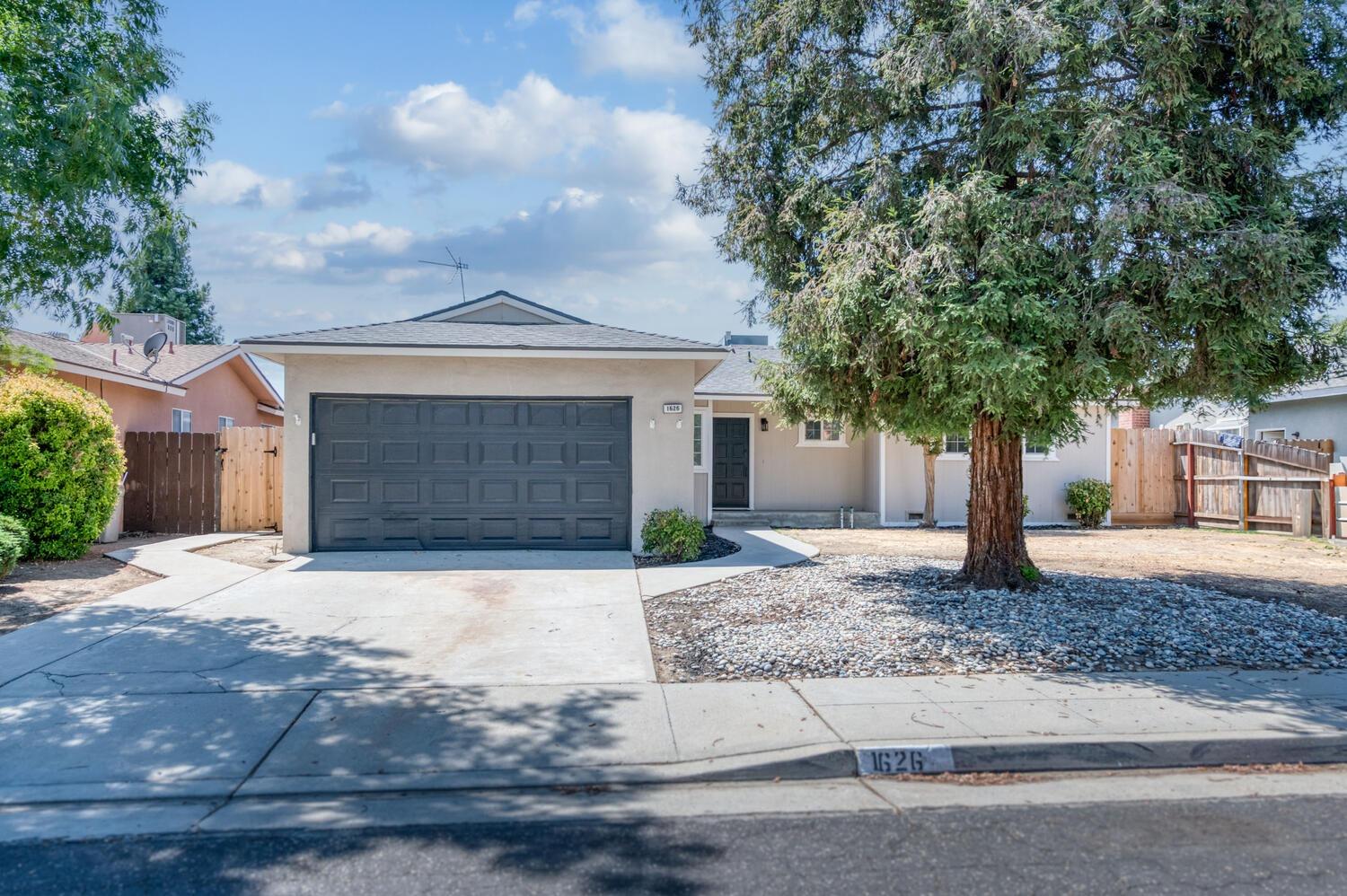 a front view of a house with garage