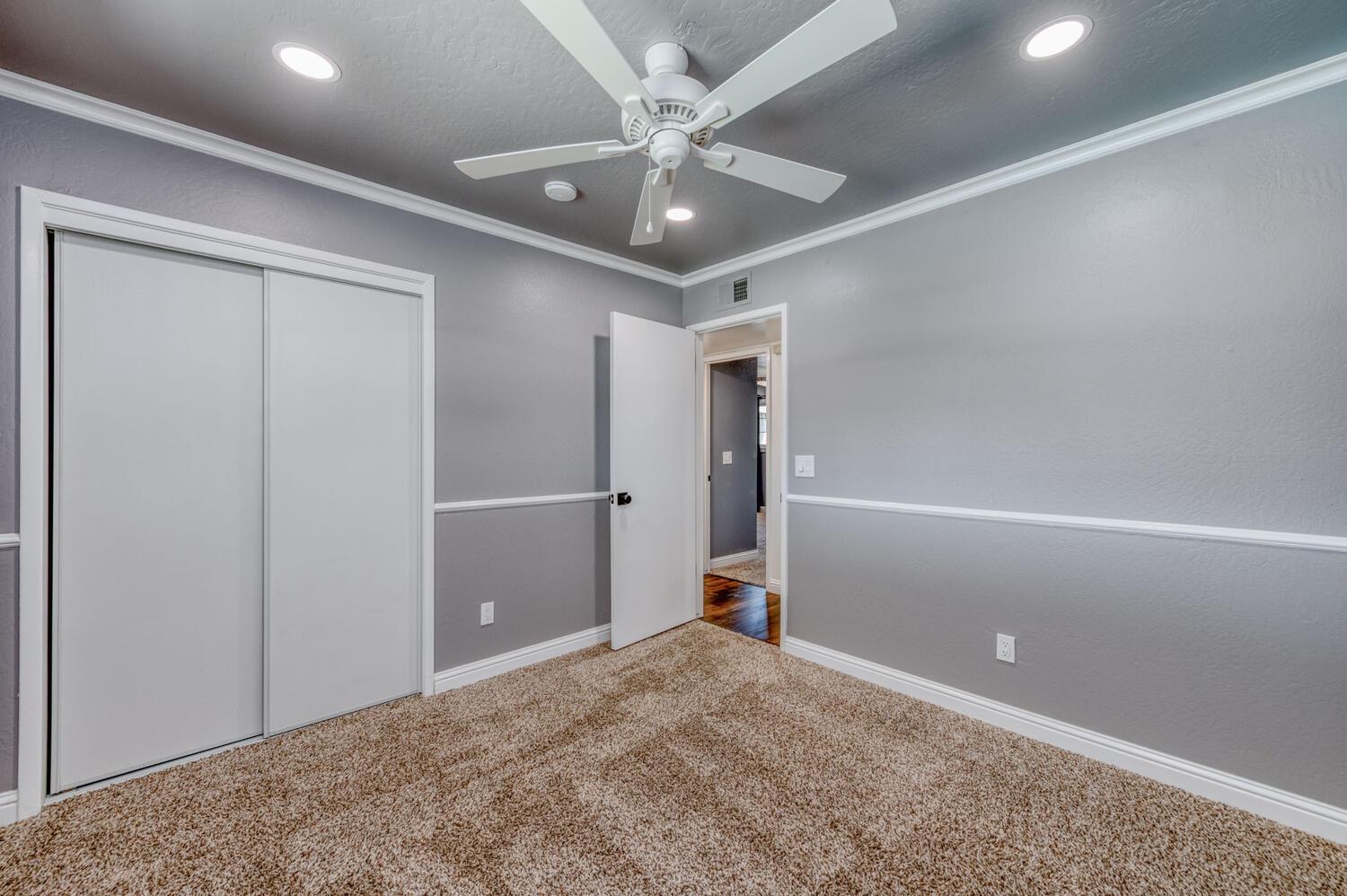 1626 Bliss Avenue Clovis, CA 93611 - Photo 20 of 31 en empty room with ceiling fan and window