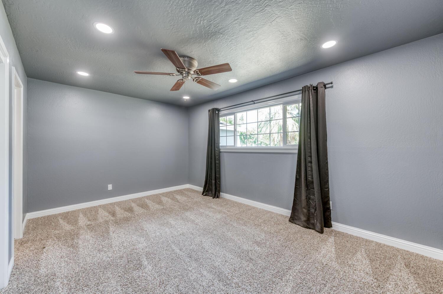 1626 Bliss Avenue Clovis, CA 93611 - Photo 23 of 31 an empty room with windows and closet
