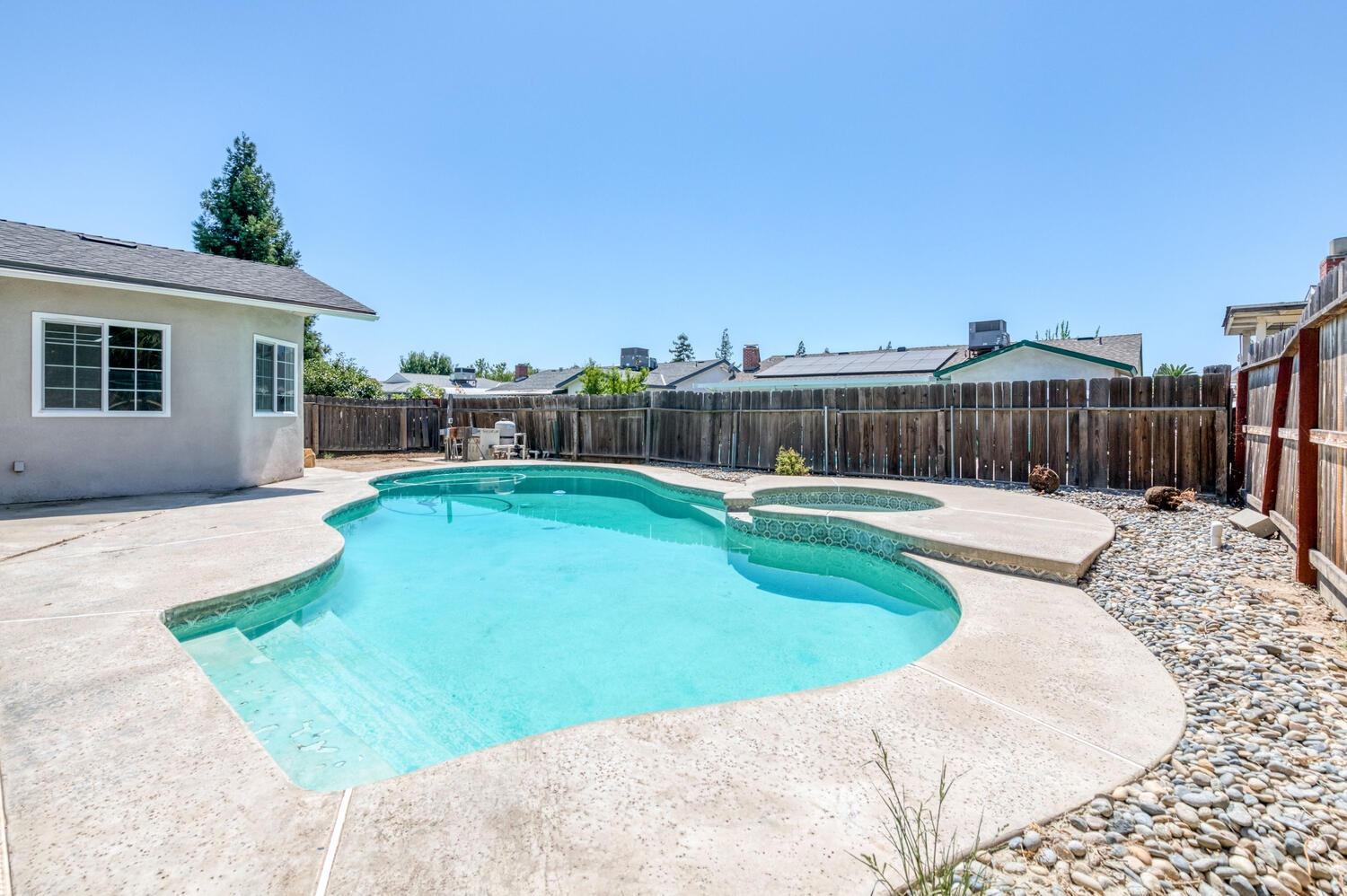 1626 Bliss Avenue Clovis, CA 93611 - Photo 27 of 31 a swimming pool with outdoor seating and yard