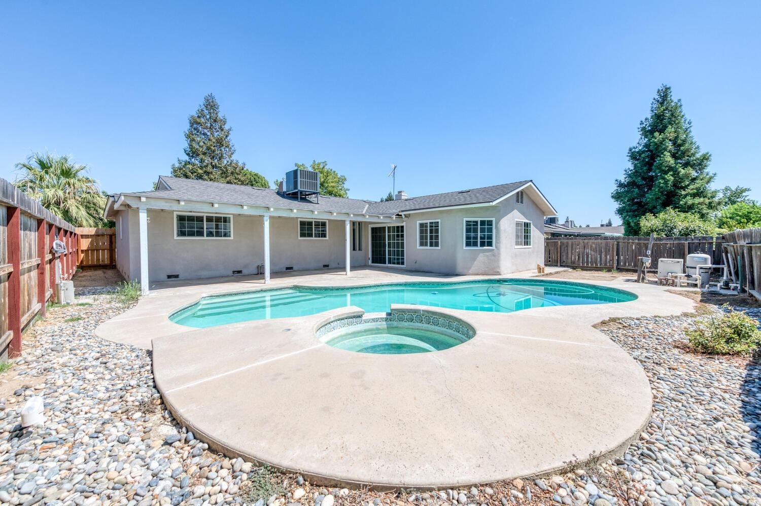1626 Bliss Avenue Clovis, CA 93611 - Photo 29 of 31 a view of house with a swimming pool