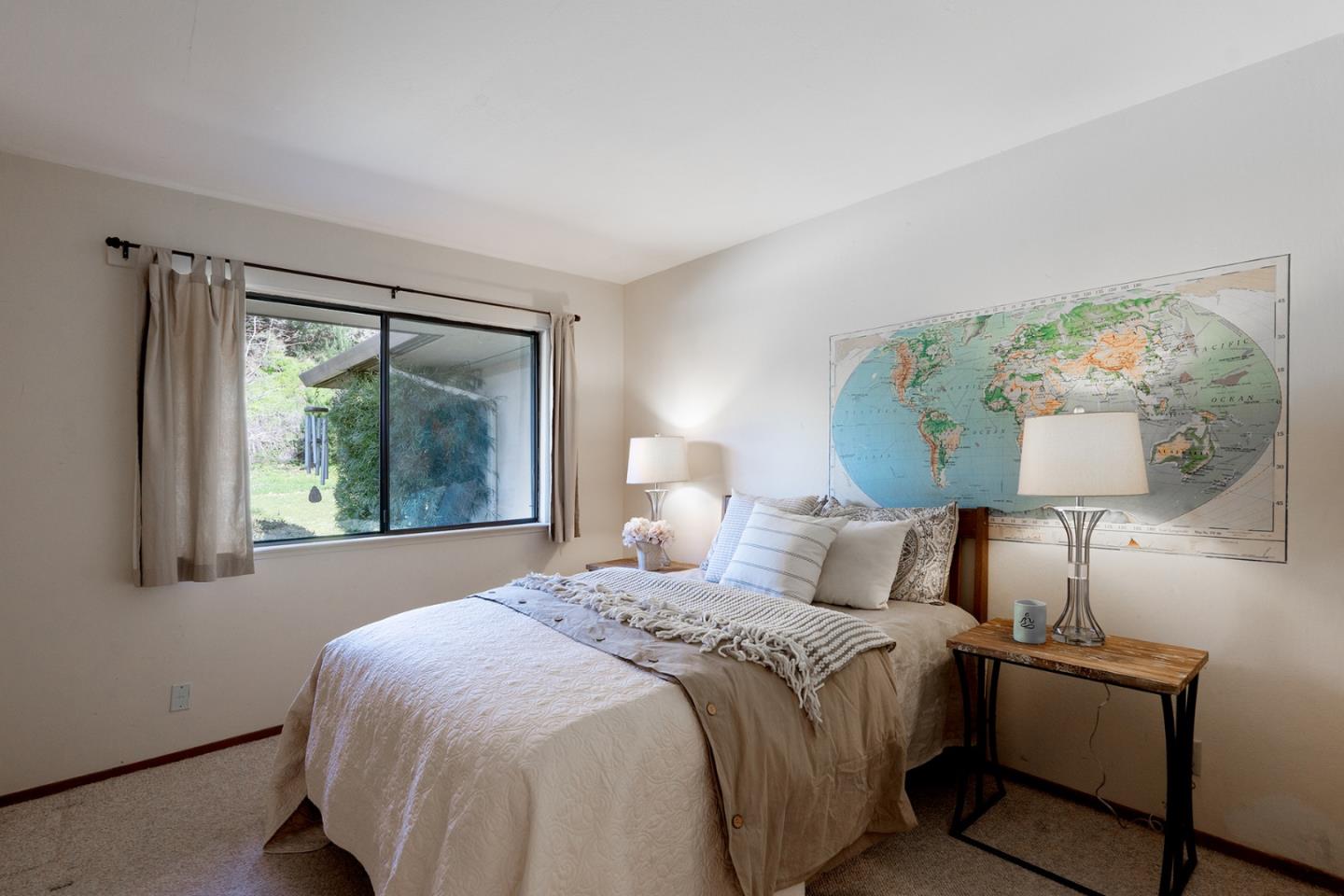 6405 Brookdale Drive Carmel, CA 93923 - Photo 14 of 32 a bedroom with a bed and window