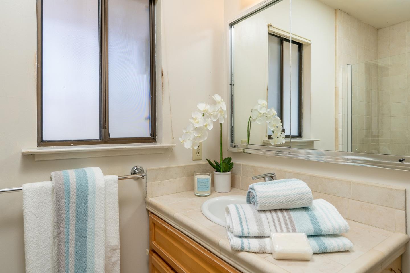 6405 Brookdale Drive Carmel, CA 93923 - Photo 17 of 32 a kitchen with a sink and a mirror