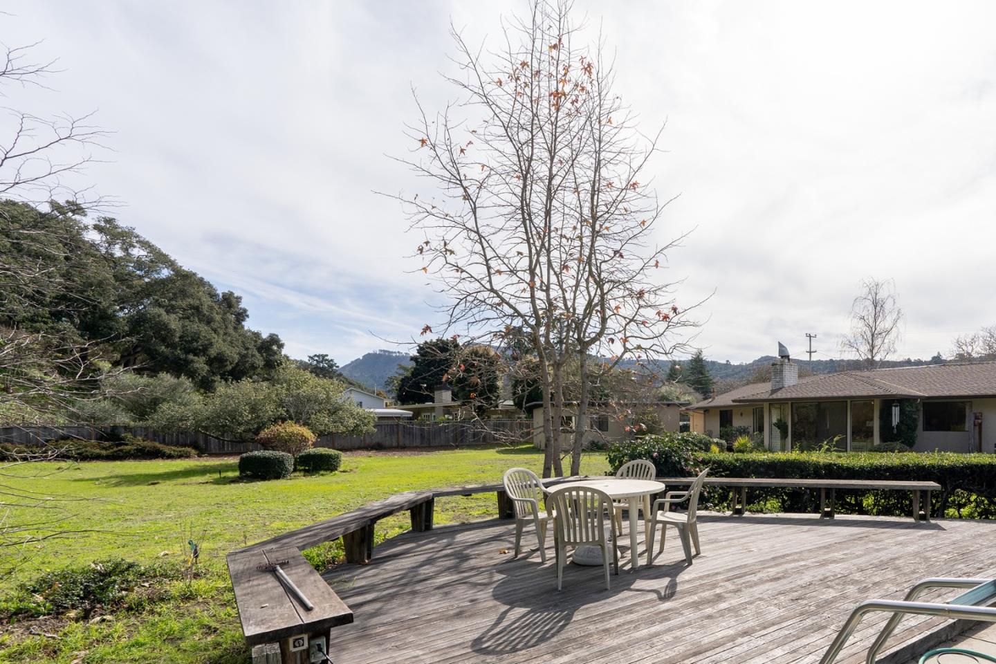 6405 Brookdale Drive Carmel, CA 93923 - Photo 23 of 32 a view of a patio with table and chairs under an umbrella