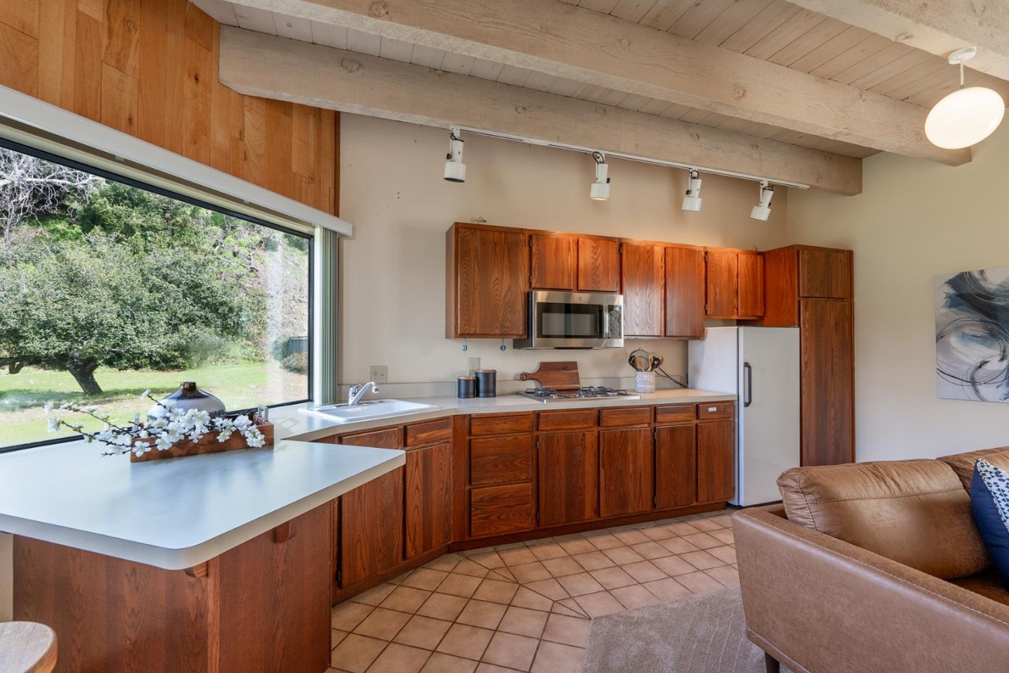 6405 Brookdale Drive Carmel, CA 93923 - Photo 28 of 32 a kitchen with stainless steel appliances granite countertop a sink dishwasher stove and refrigerator