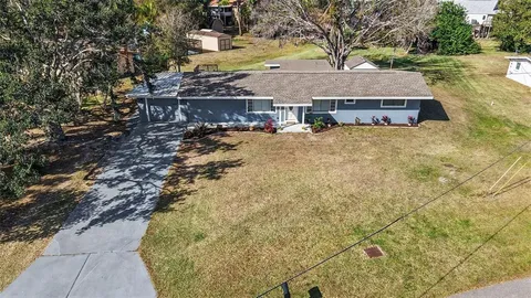a view of residential houses with yard