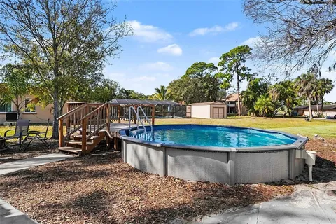 a view of a swimming pool with a patio