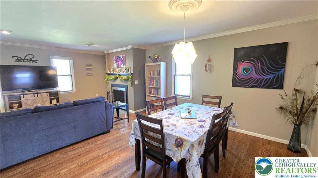 194 Springhouse Road Allentown, PA 18104 - Photo 8 of 34 This inviting space seamlessly blends living and dining, offering both comfort and functionality.