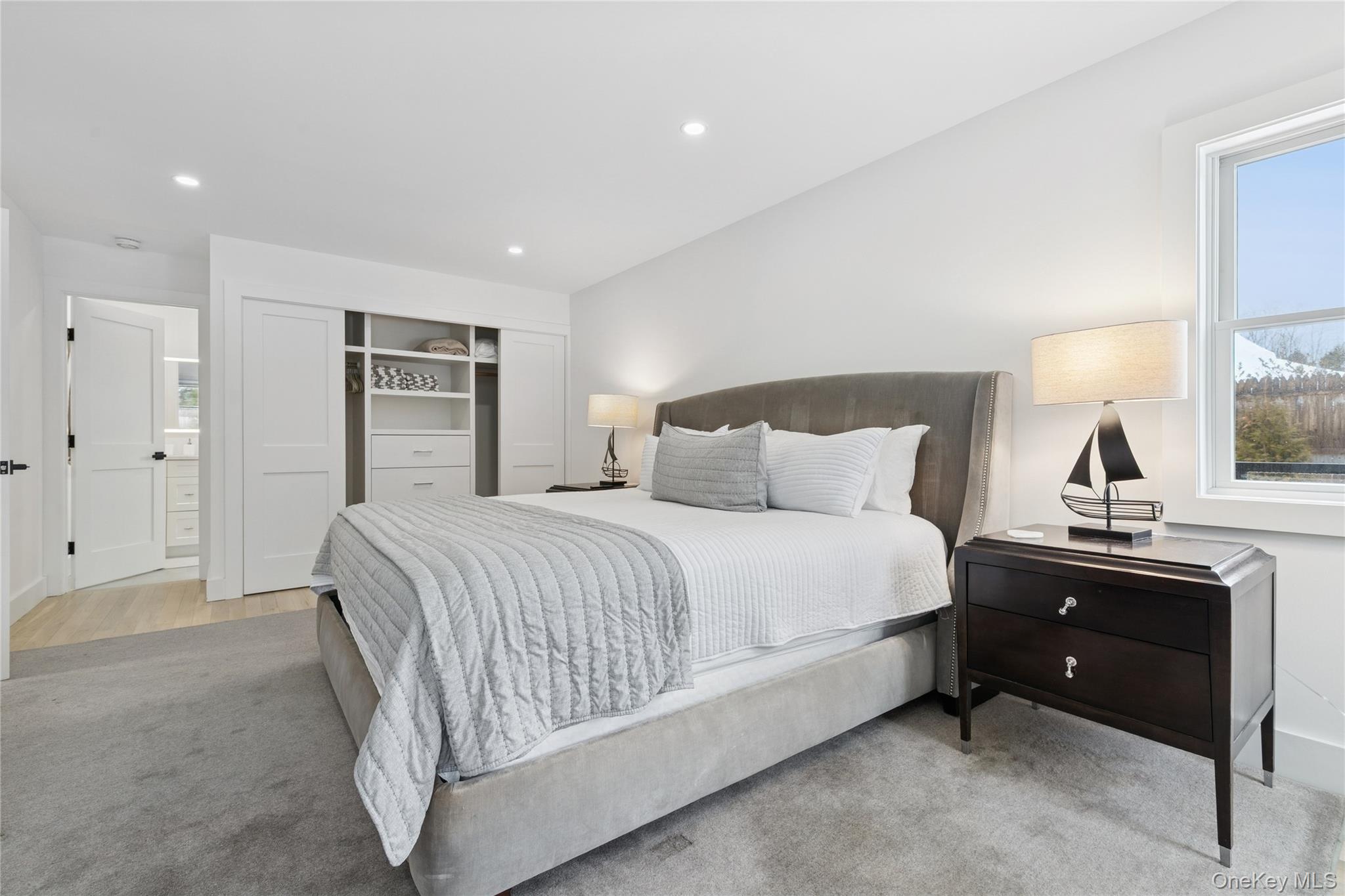 10 Sagamore Road Hampton Bays, NY 11946 - Photo 19 of 41 a bedroom with a bed and a desk