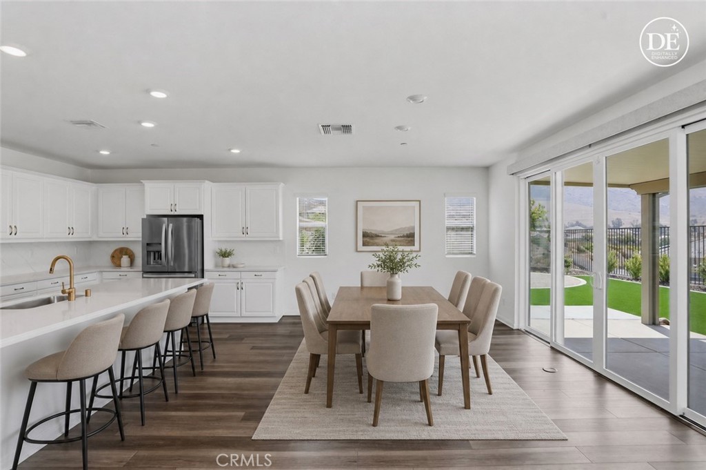 21159 Blue Jeans Court Riverside, CA 92507 - Photo 33 of 63 a view of a dining room with furniture and wooden floor