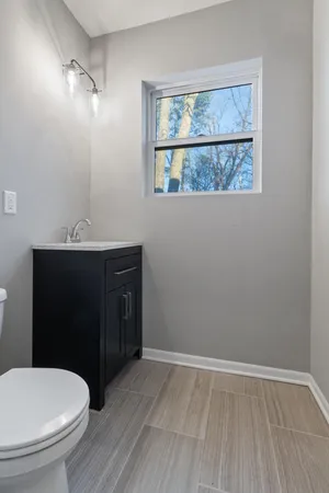 a bathroom with a toilet and a sink