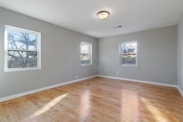 a view of empty room with windows