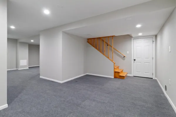 an empty room with yellow lighting