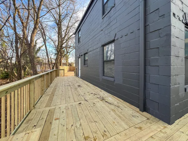 a view of a brick house with a large window