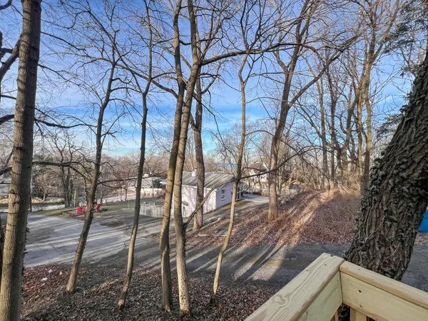 a backyard of a house with lots of green space
