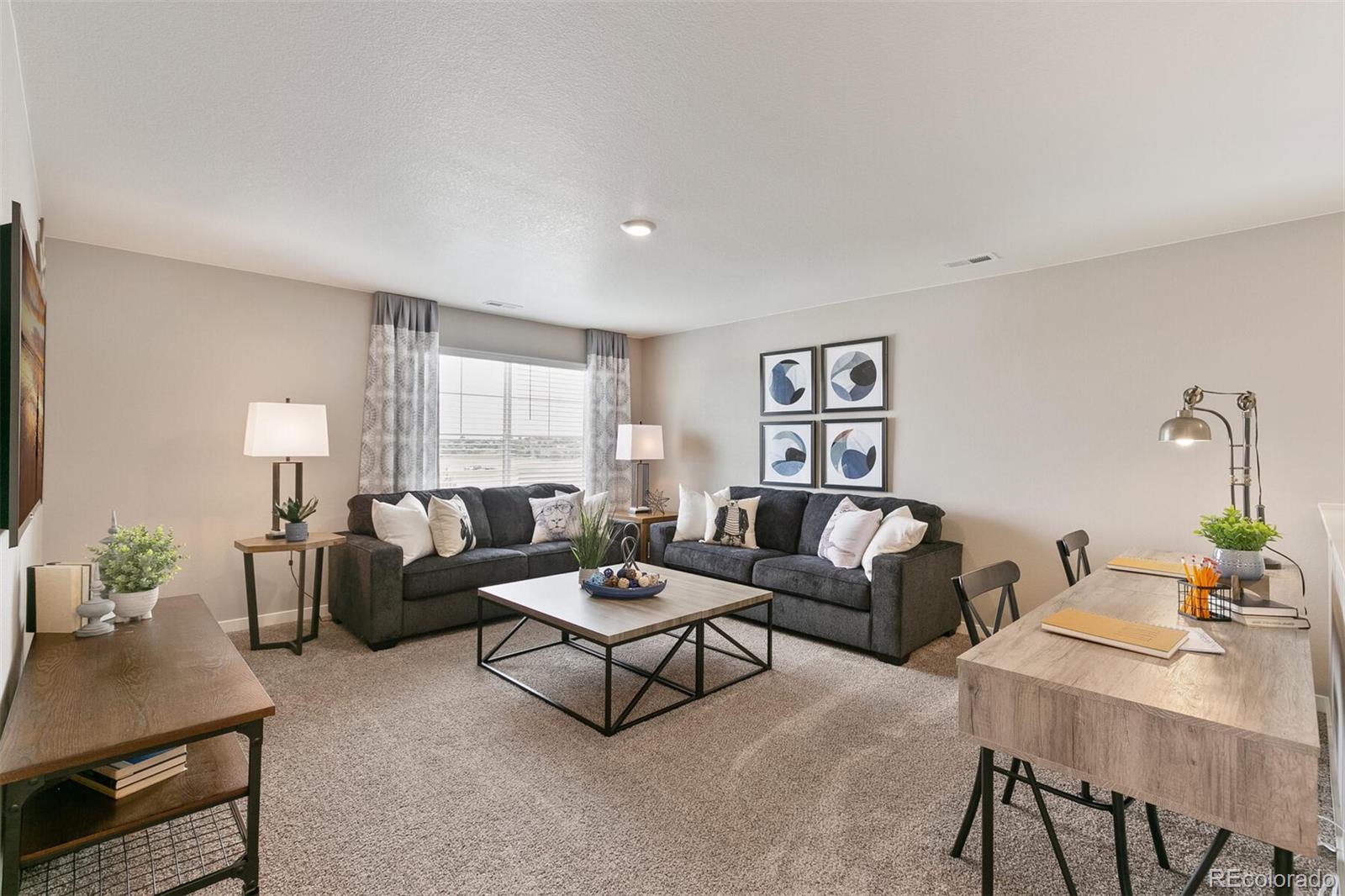 2238 Base Street Fort Lupton, CO 80621 - Photo 18 of 30 a living room with furniture and a window