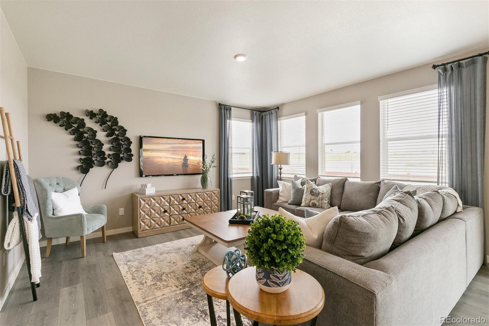 2238 Base Street Fort Lupton, CO 80621 - Photo 6 of 30 a living room with furniture and a large window