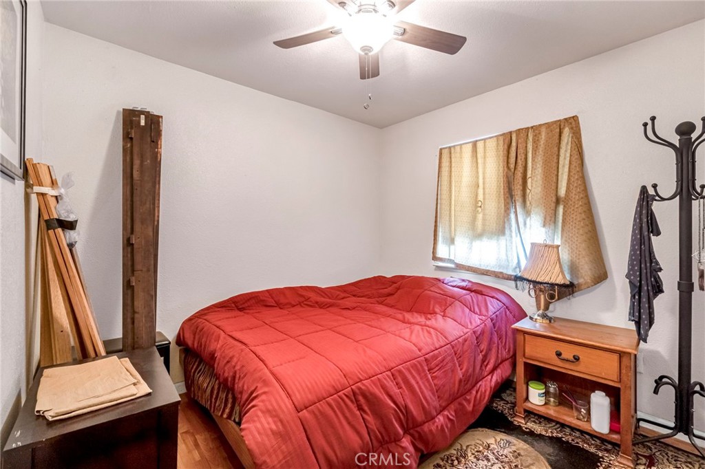 1624 B Street Fresno, CA 93706 - Photo 28 of 32 a bedroom with a bed and a flat tv screen