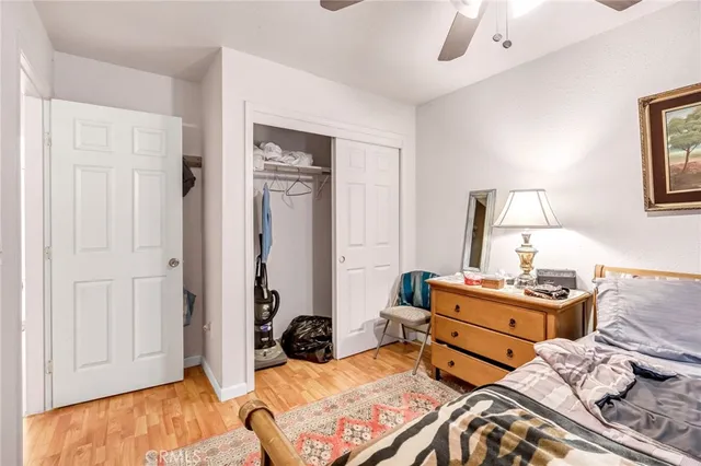 a bedroom with furniture and a window