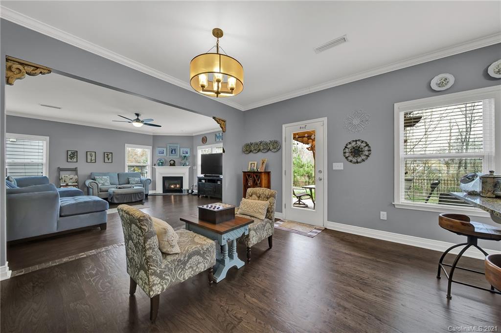 2162 Bluebell Way Tega Cay, SC 29708 - Photo 13 of 37 a view of a livingroom with furniture window and wooden floor