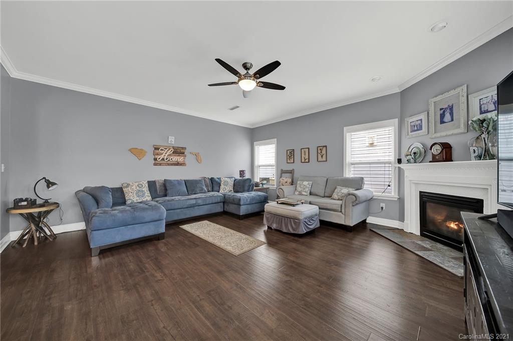 2162 Bluebell Way Tega Cay, SC 29708 - Photo 17 of 37 a living room with furniture and a fireplace