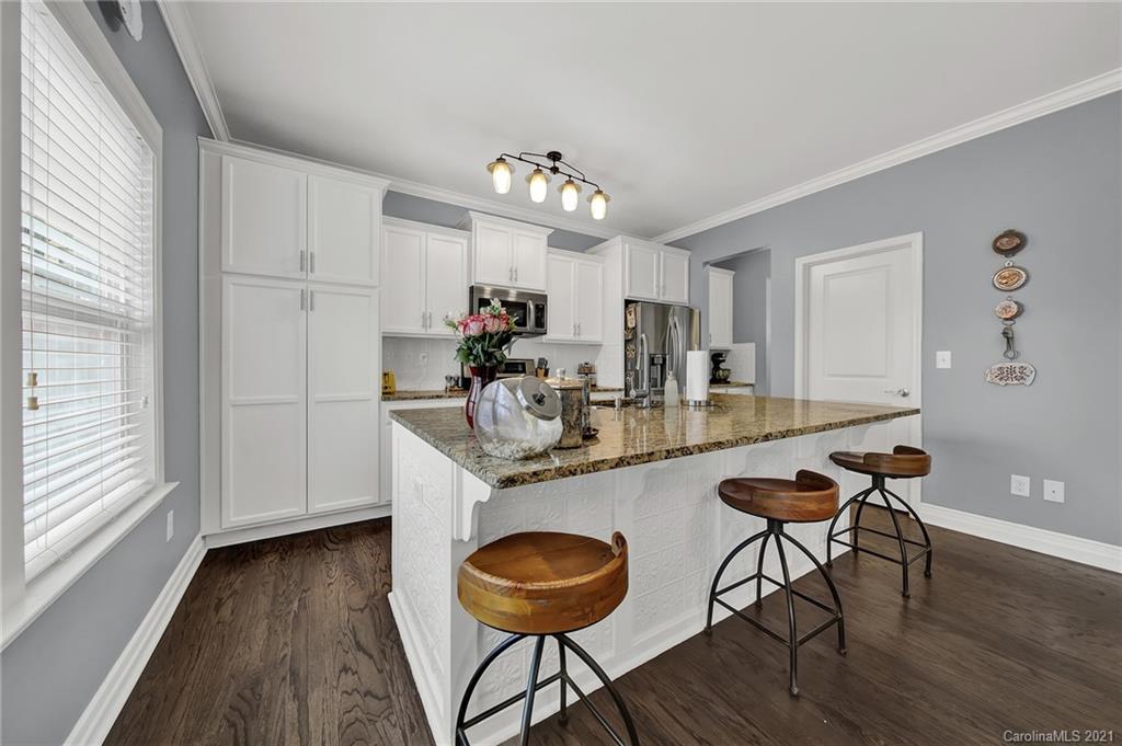 2162 Bluebell Way Tega Cay, SC 29708 - Photo 6 of 37 a kitchen with sink and chairs