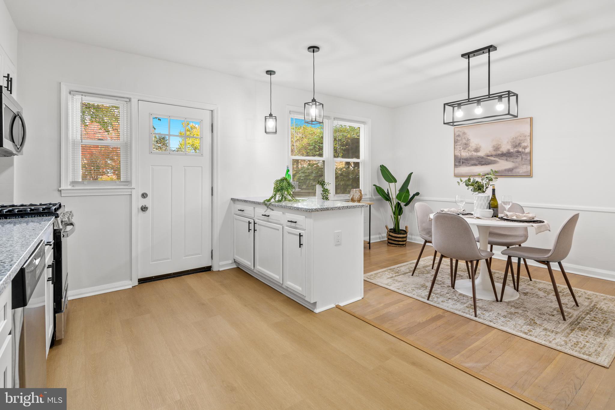 1212 Cedarcroft Road Baltimore, MD 21239 - Photo 13 of 42 a view of a dining room with furniture window and wooden floor