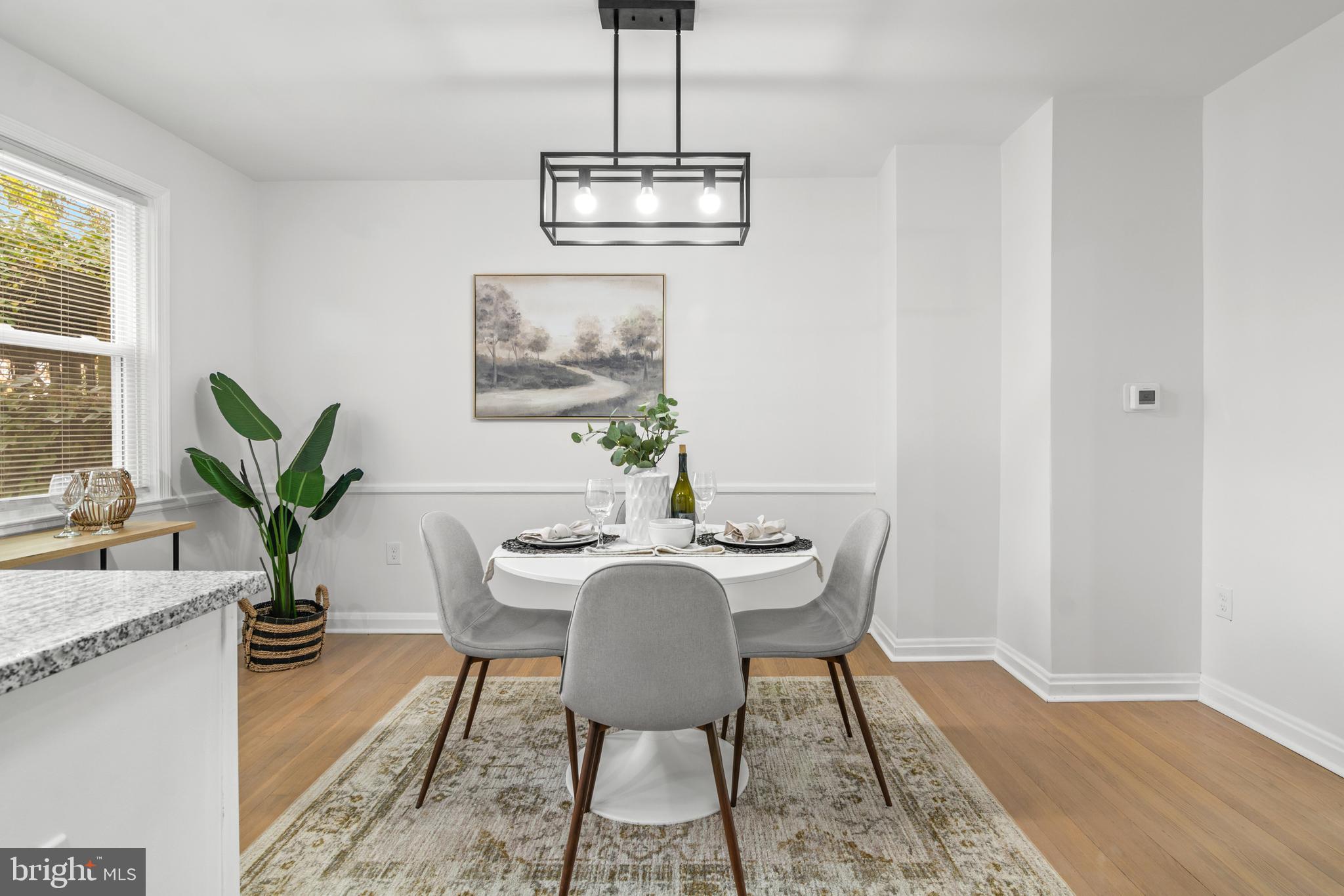 1212 Cedarcroft Road Baltimore, MD 21239 - Photo 17 of 42 a dining room with furniture and window
