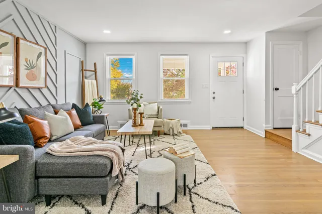 a living room with furniture and a table