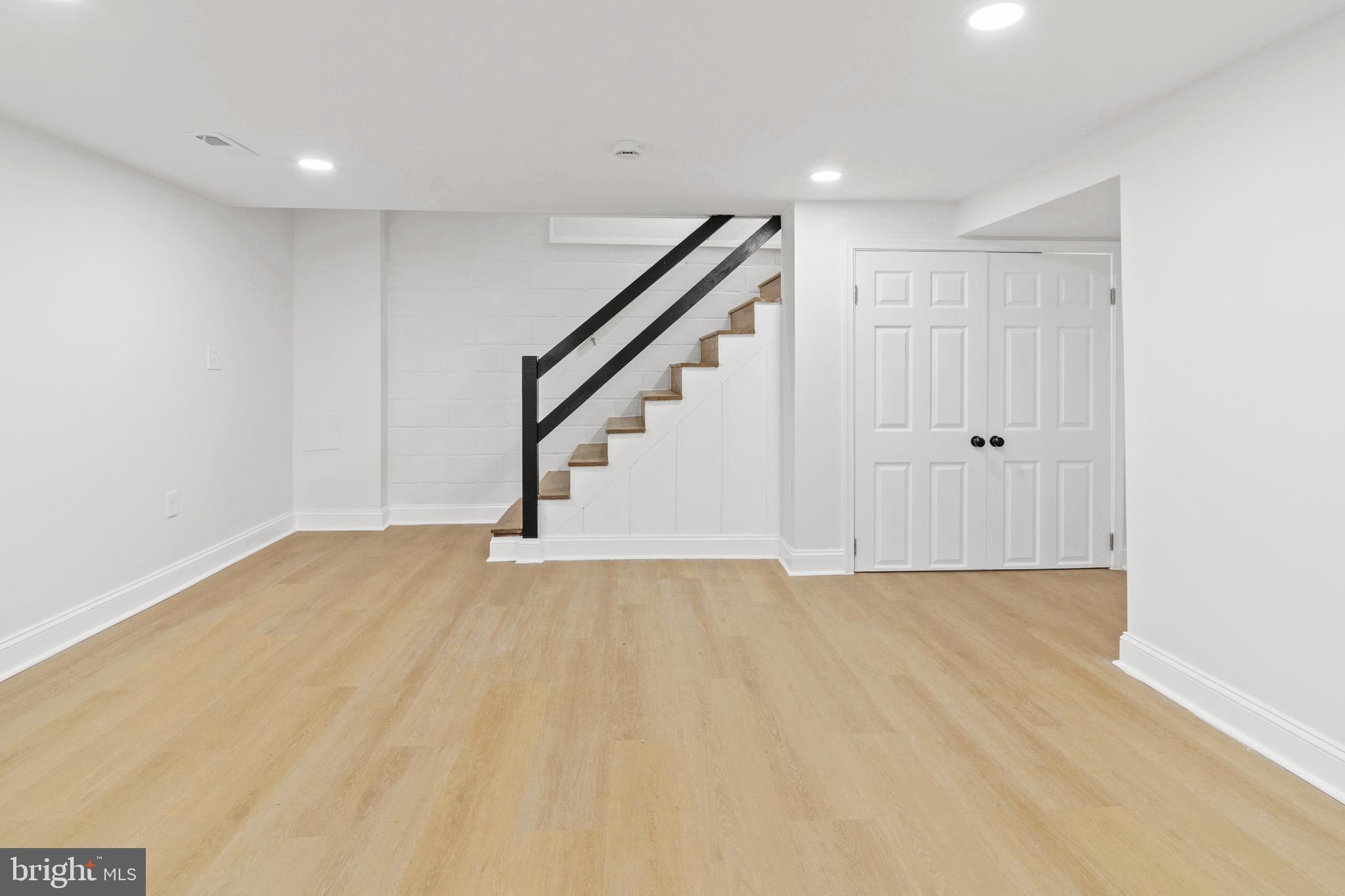 1212 Cedarcroft Road Baltimore, MD 21239 - Photo 31 of 42 a view of an empty room with stairs