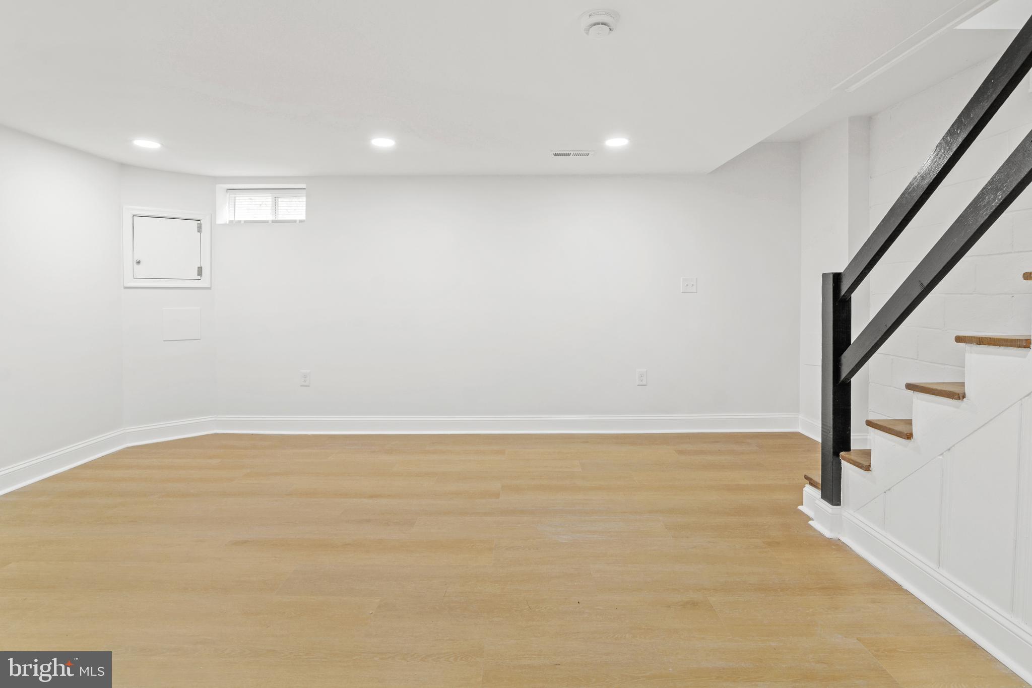 1212 Cedarcroft Road Baltimore, MD 21239 - Photo 32 of 42 a view of an empty room with stairs