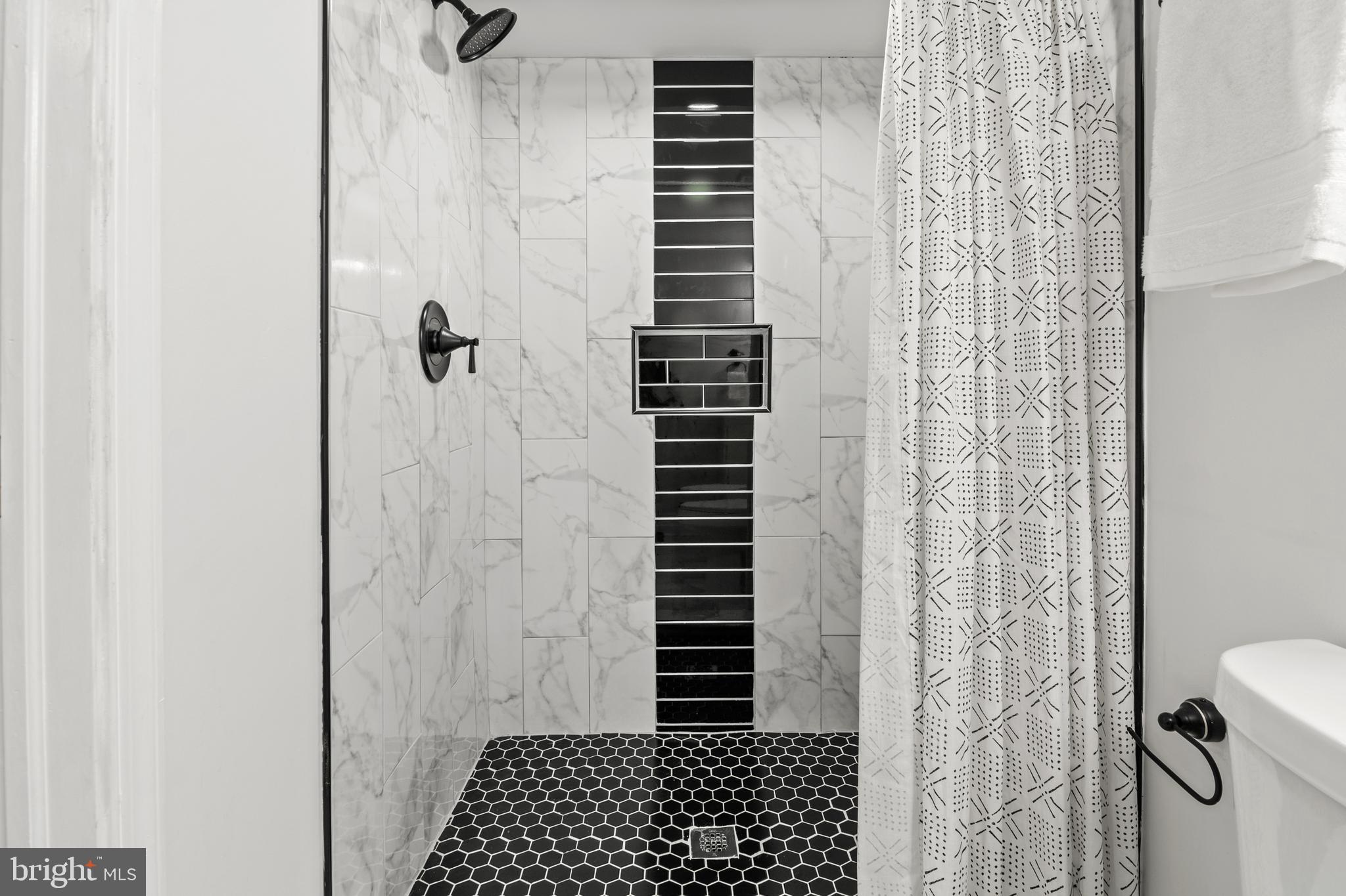 1212 Cedarcroft Road Baltimore, MD 21239 - Photo 35 of 42 a bathroom with a shower