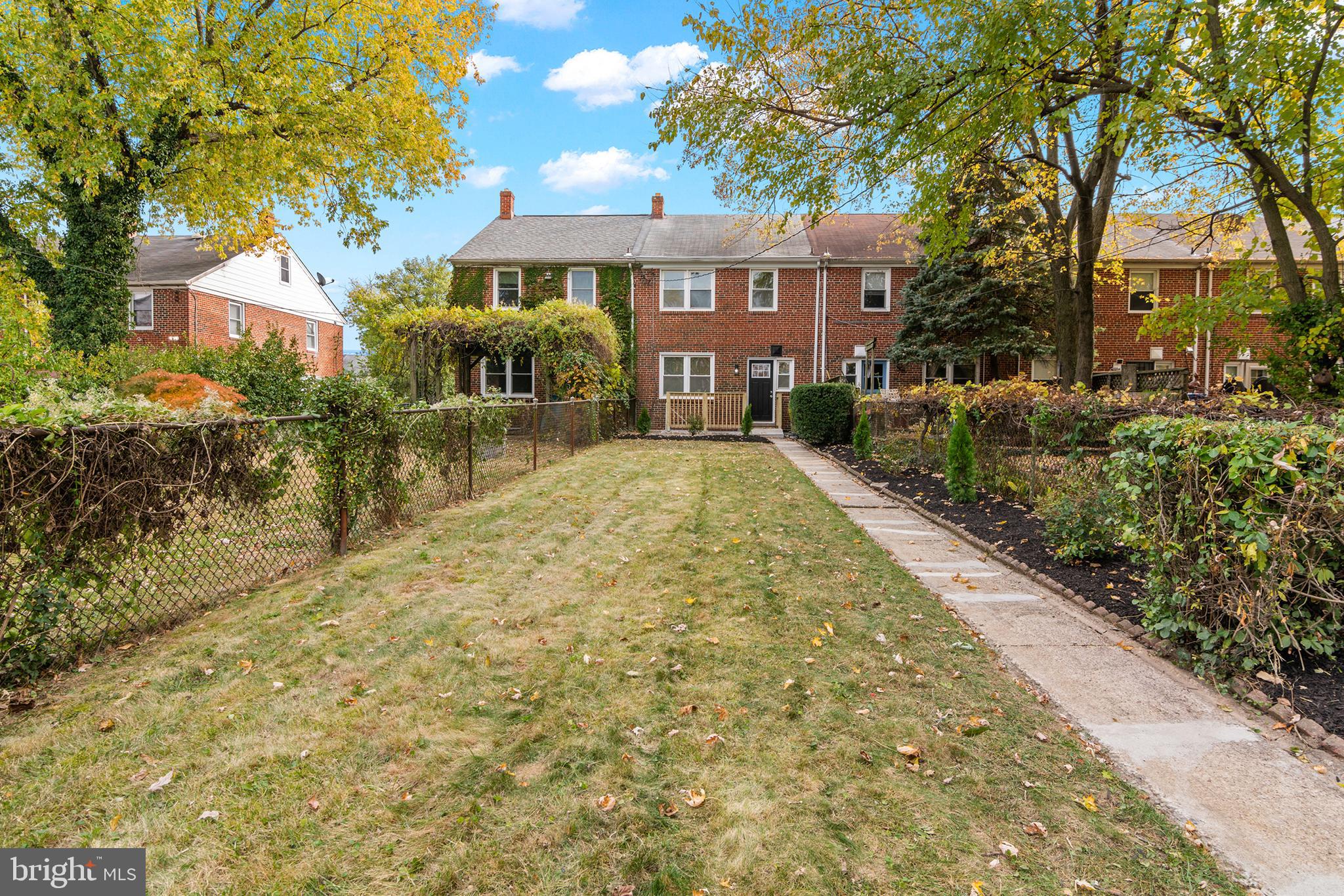 1212 Cedarcroft Road Baltimore, MD 21239 - Photo 38 of 42 a view of residential houses with yard and tree s