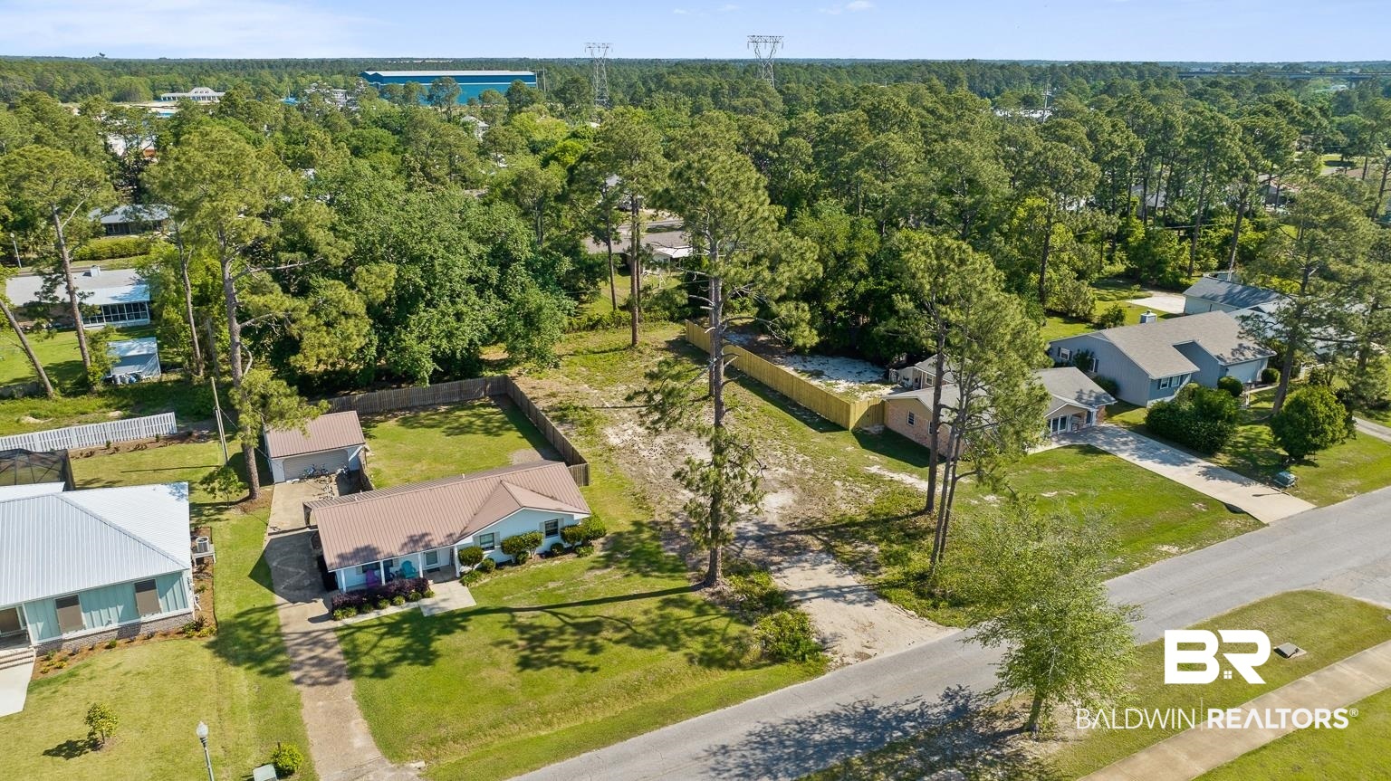 348 West 22nd Avenue Gulf Shores, AL 36542 - Photo 4 of 13 Birds eye view of property featuring a wooded view