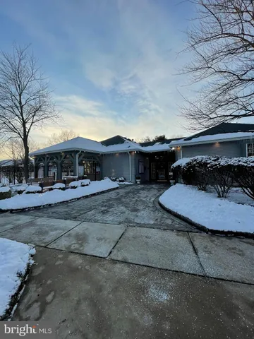 a view of a chairs and table in the patio