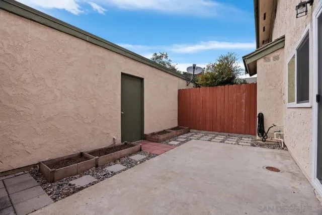 a view of a backyard of the house