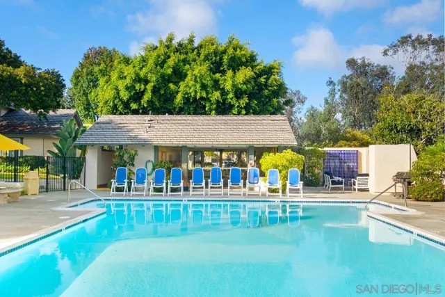 a view of a swimming pool with an outdoor seating