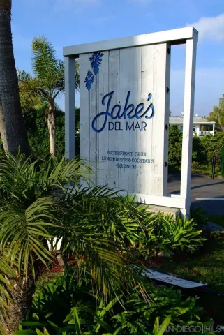 a sign that is on a brick wall