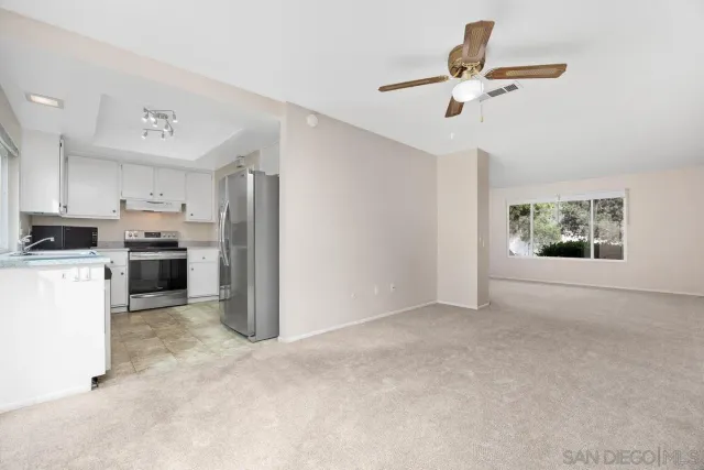 a view of kitchen with cabinets and stainless steel appliances