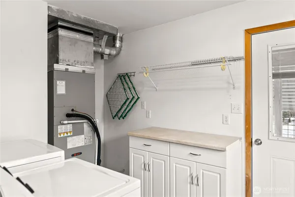 a bathroom with a sink a mirror and shower