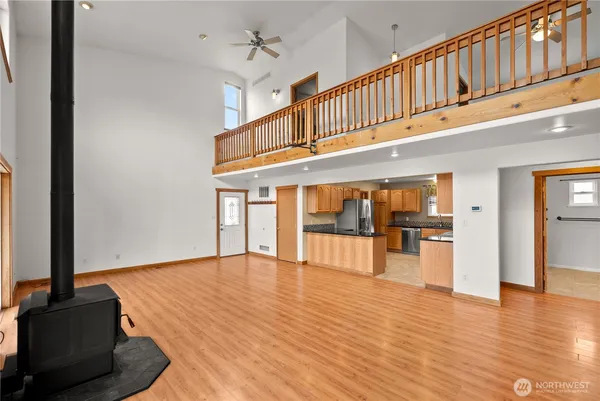 a view of an entryway with wooden floor