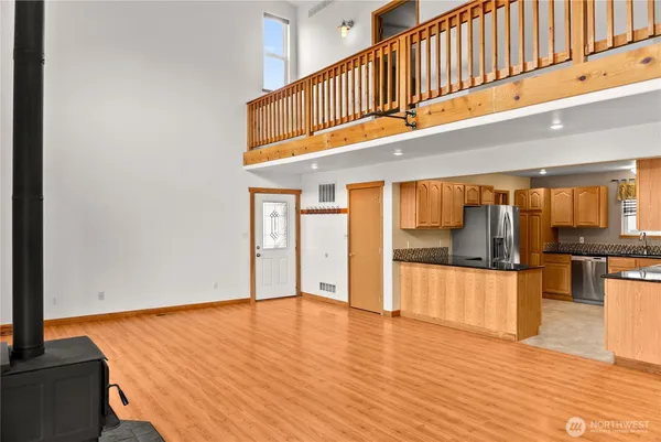 a view of an entryway with wooden floor