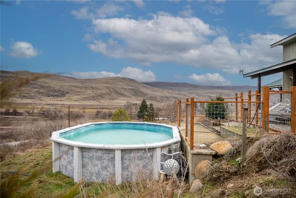 a view of a swimming pool with a yard